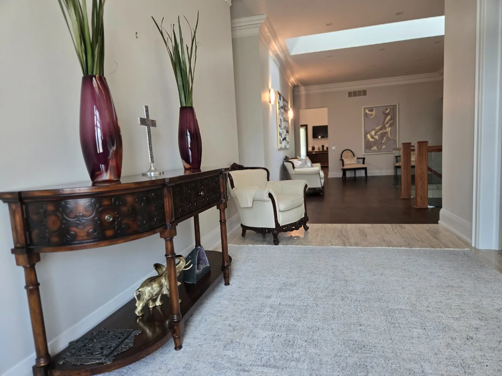 Front foyer viewed from an angle after renovation cleaning — floors, walls, and surfaces cleaned and reset to move-in ready condition