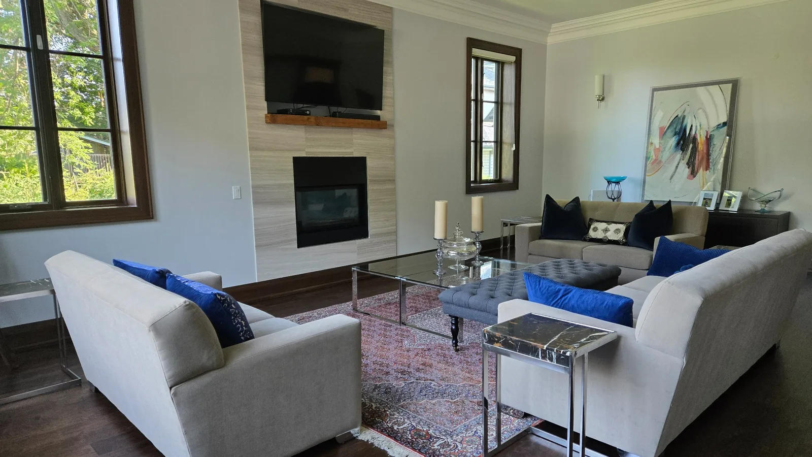 Living room fully cleaned and reset after renovation — furniture, rugs, and decor restored to original placement using client reference photos